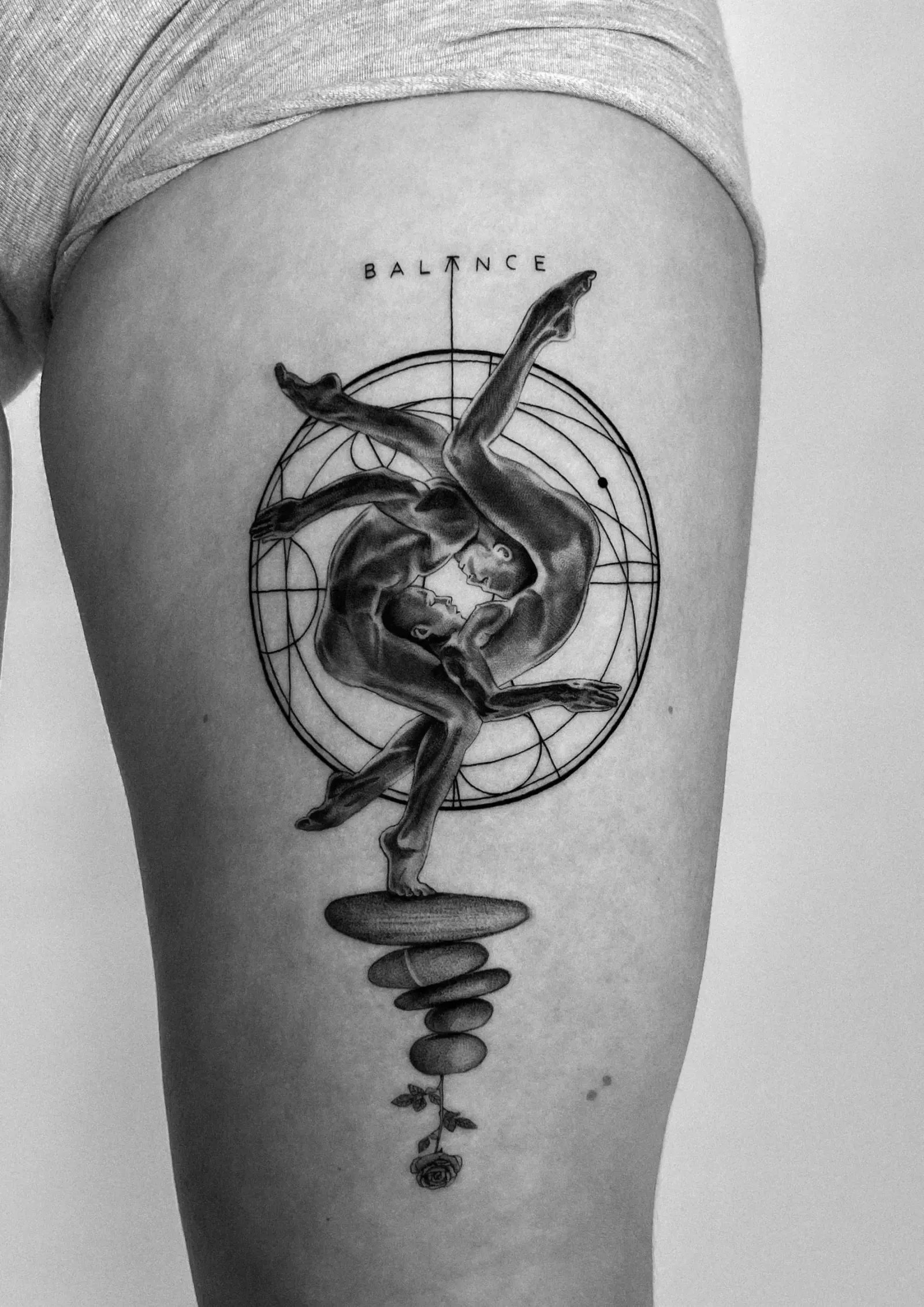Tattoo 02: balance figure on the upper arm