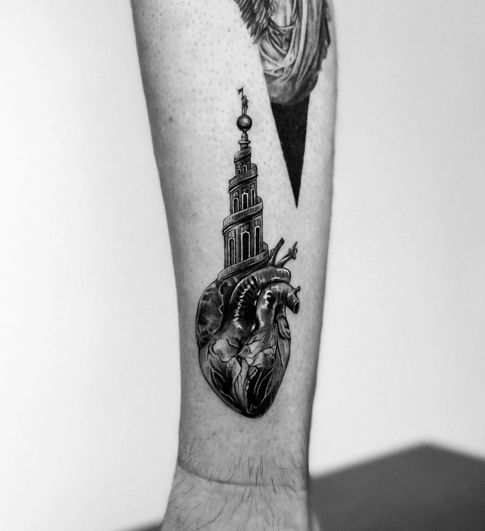 Tattoo 09: heart and spire on the forearm