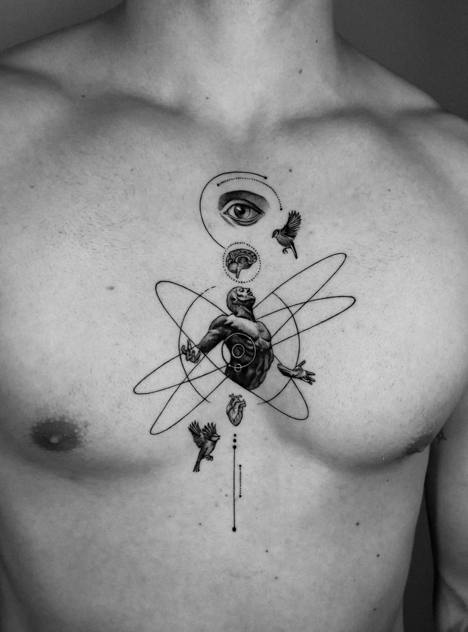 Tattoo 13: orbit figure on the chest